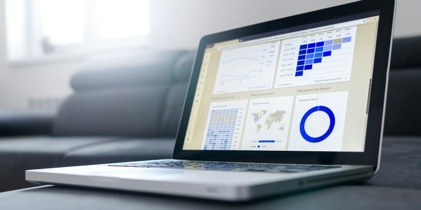 A laptop displaying analytics and website performance charts, representing on-page SEO optimization for improving website visibility and search rankings.