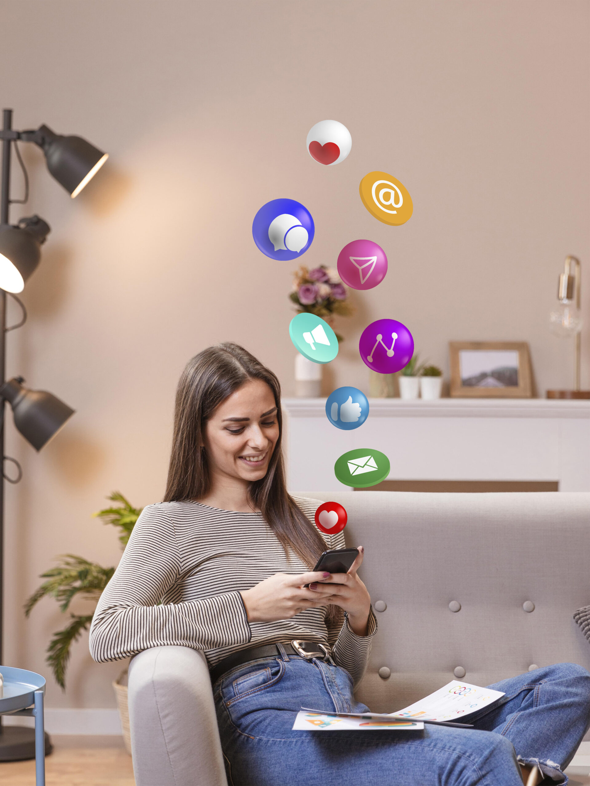 Smiling woman using a smartphone with floating social media icons representing digital marketing and online communication.